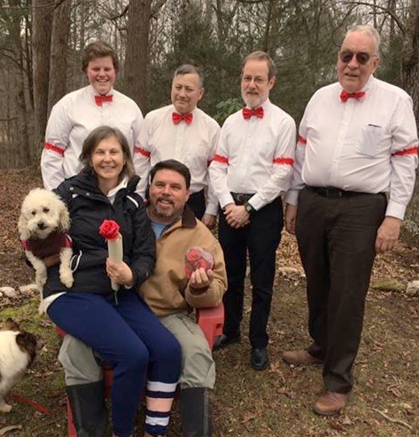 QbJeffFarmerGrpEnh A quartet with a couple and their pets in their yard on Valentine's Day.